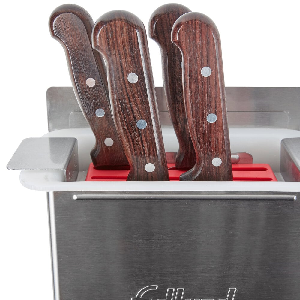 Knives with riveted-on wood handles in knife holder