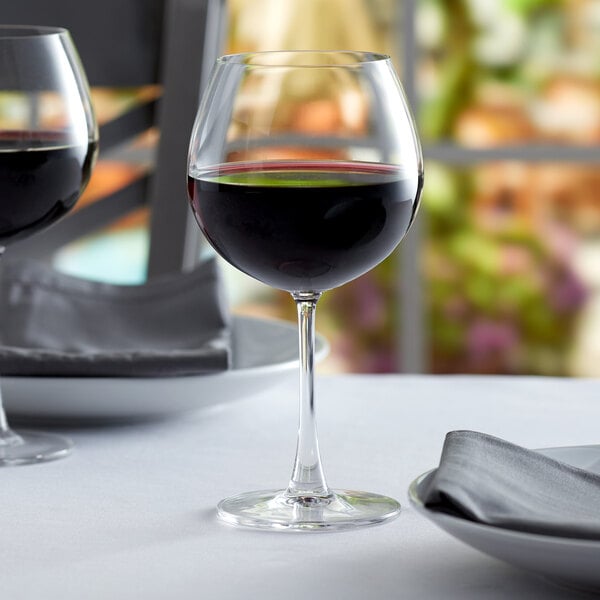 Pinot noir glass filled with pinot noir wine on an elegant table
