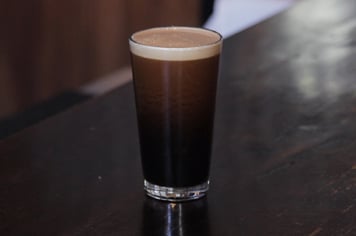 a glass of nitro beer