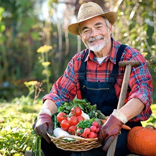 farmer holding basket of vegetables