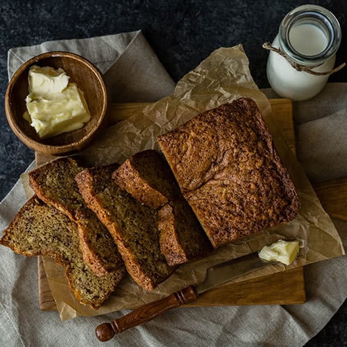 Butter and banana bread on a table 