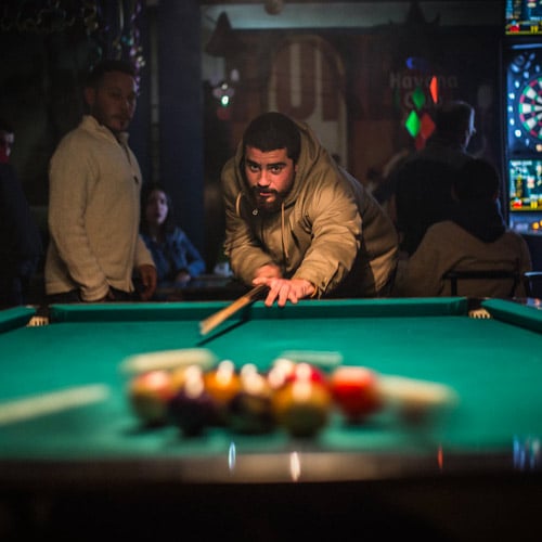 Man playing pool at a sports bar