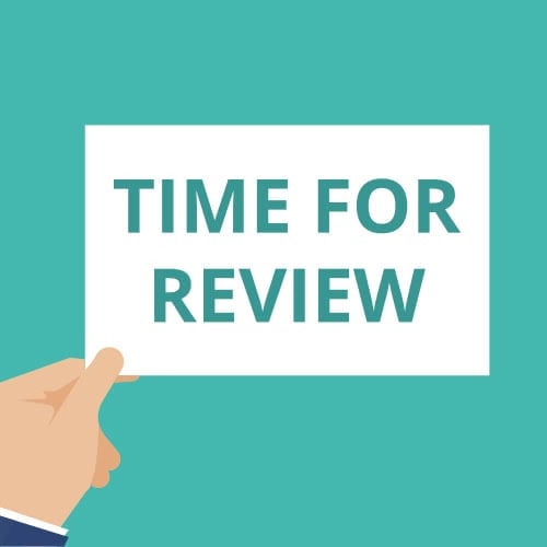 illustrated hand holding a paper that says Time For Review