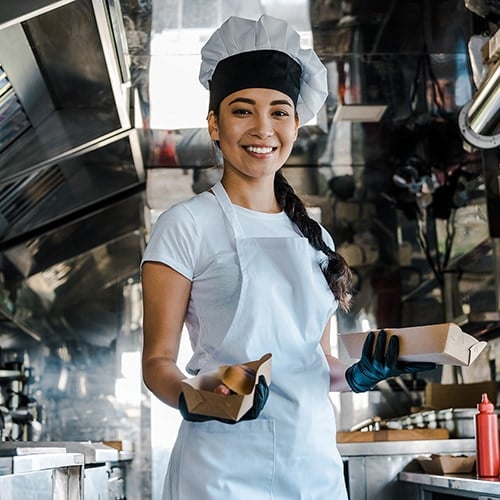 chef smiling in food truck