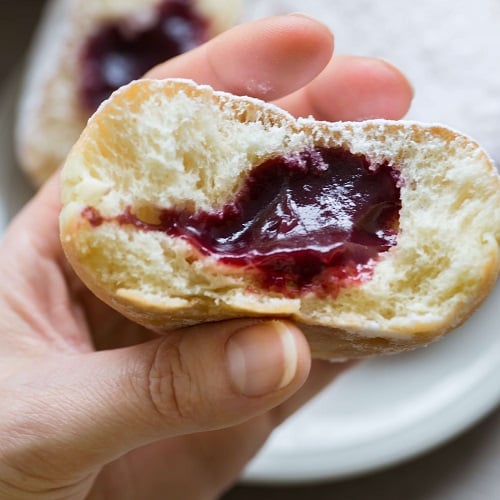 traditional german polish donut with raspberry jam