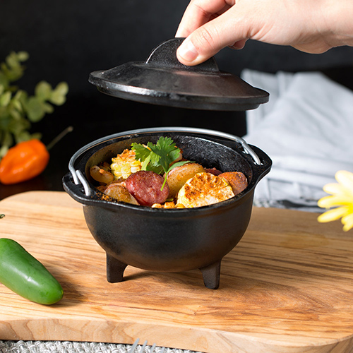 potatoes sausage and corn on the in mini cast iron cauldron