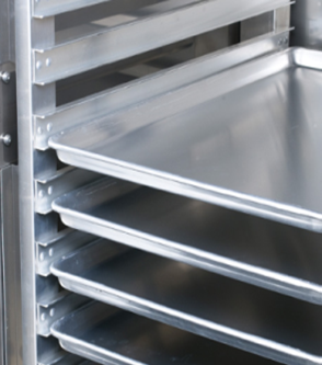 Cabinet with lip load slides, holding full size sheet pans