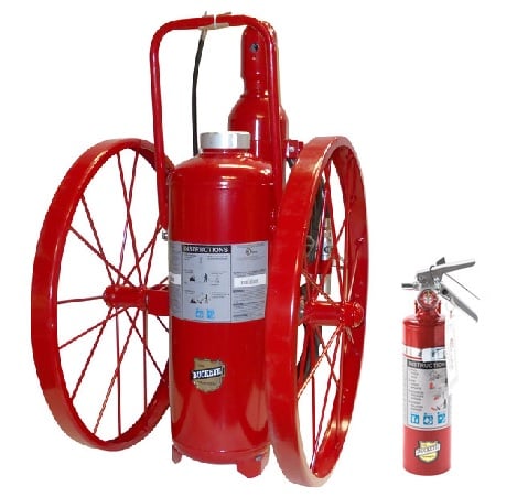Large red fire extinguisher with built-in wheels next to small red fire extinguisher
