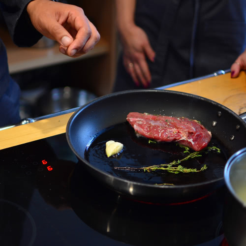 steak being cooked in induction cookware