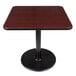 Lancaster Table & Seating Standard Height Table with 30" x 30" Reversible Cherry / Black Table Top and Round Base Plate Main Thumbnail 3