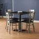 Lancaster Table & Seating 30" x 30" Reversible Cherry / Black Standard Height Dining Set with Clear Coat Steel Cross Back Chair and Padded Seat Main Thumbnail 1