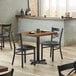 Lancaster Table & Seating 24" x 30" Rectangular Standard Height Recycled Wood Butcher Block Table with 2 Black Cross Back Chairs - Vintage Main Thumbnail 1