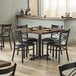 Lancaster Table & Seating 36" Square Standard Height Recycled Wood Butcher Block Table with 4 Black Cross Back Chairs - Vintage Main Thumbnail 1