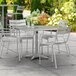 Lancaster Table & Seating 36" x 36" Silver Powder-Coated Aluminum Dining Height Outdoor Table with Umbrella Hole and 4 Arm Chairs Main Thumbnail 1