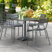 Lancaster Table & Seating 32" x 32" Matte Gray Powder-Coated Aluminum Dining Height Outdoor Table with Umbrella Hole and 4 Arm Chairs Main Thumbnail 1