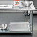 Regency 30" x 96" 18-Gauge 304 Stainless Steel Commercial Work Table with 4" Backsplash and Galvanized Undershelf Main Thumbnail 1