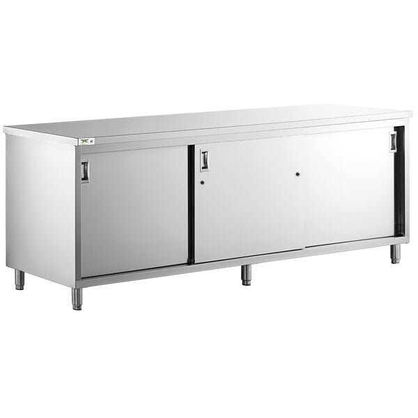 Scratch and Dent Regency 24" x 96" 16 Gauge Type 304 Stainless Steel Enclosed Base Table with Sliding Doors and Adjustable Midshelf