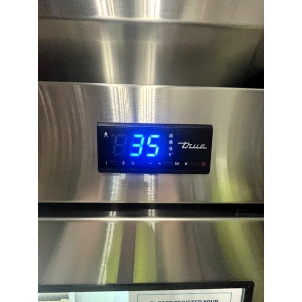 Scratch and Dent True T-72G-HC~FGD01 78 1/8" 3 Section Glass Door Reach-In Refrigerator