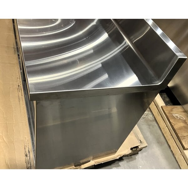 Scratch and Dent Regency 24" x 96" 16 Gauge Type 304 Stainless Steel Enclosed Base Sliding Door Table with Adjustable Midshelf and 6" Backsplash