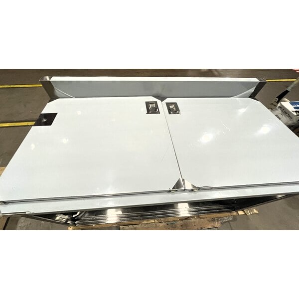 Scratch and Dent Regency 30" x 60" 16 Gauge Type 304 Stainless Steel Enclosed Base Sliding Door Table with Adjustable Midshelf and 6" Backsplash