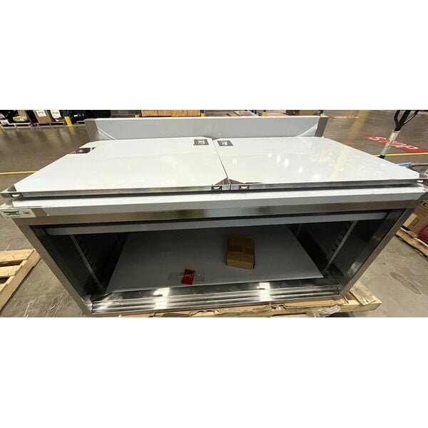 Scratch and Dent Regency 30" x 60" 16 Gauge Type 304 Stainless Steel Enclosed Base Sliding Door Table with Adjustable Midshelf and 6" Backsplash