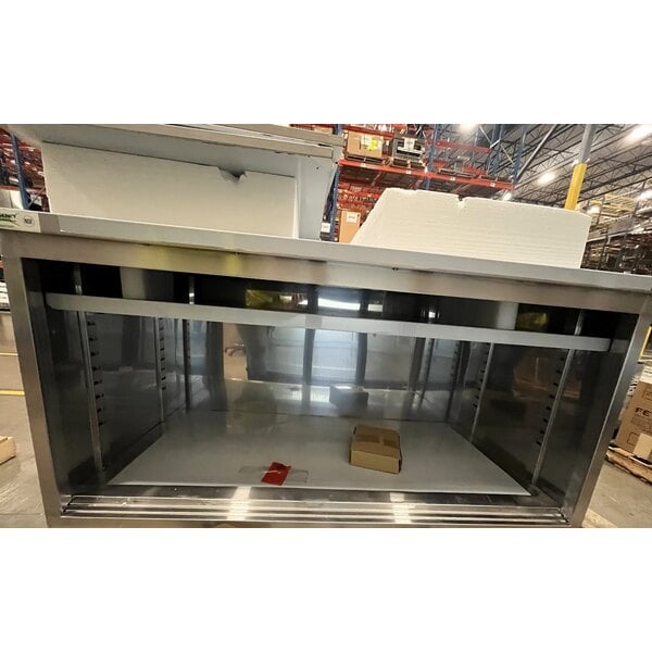 Scratch and Dent Regency 30" x 60" 16 Gauge Type 304 Stainless Steel Enclosed Base Sliding Door Table with Adjustable Midshelf and 6" Backsplash