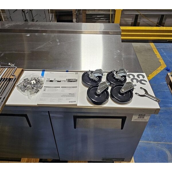 Scratch and Dent True TSSU-72-18-HC 72 3/8" 3 Door Refrigerated Sandwich Prep Table