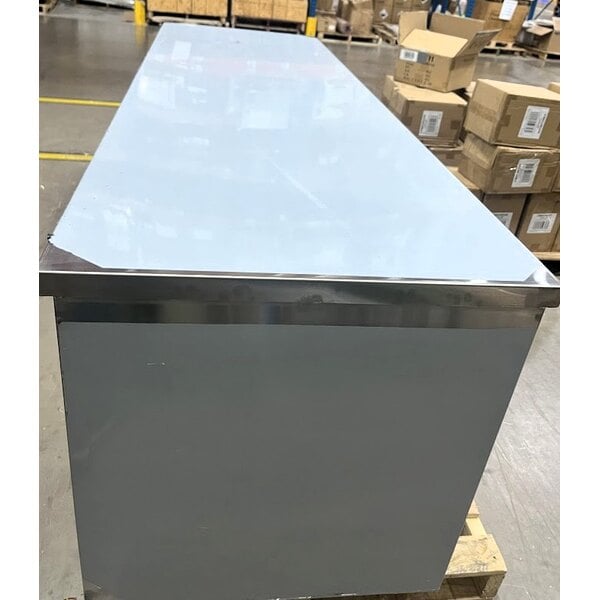 Scratch and Dent Regency 30" x 96" 16 Gauge Type 304 Stainless Steel Enclosed Base Table with Open Front and Adjustable Midshelf