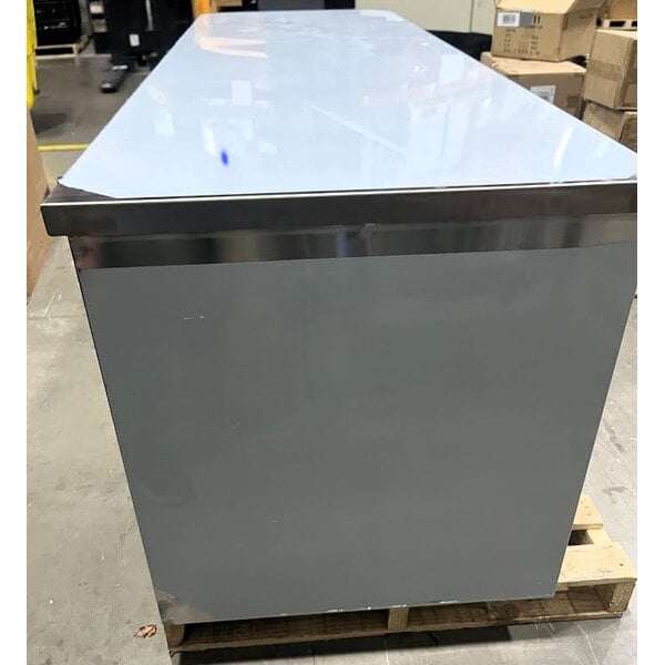 Scratch and Dent Regency 30" x 96" 16 Gauge Type 304 Stainless Steel Enclosed Base Table with Open Front and Adjustable Midshelf