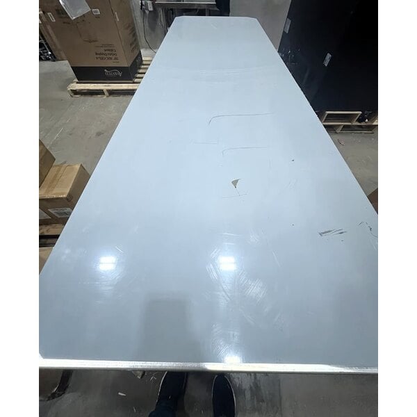 Scratch and Dent Regency 30" x 96" 16 Gauge Type 304 Stainless Steel Enclosed Base Table with Open Front and Adjustable Midshelf