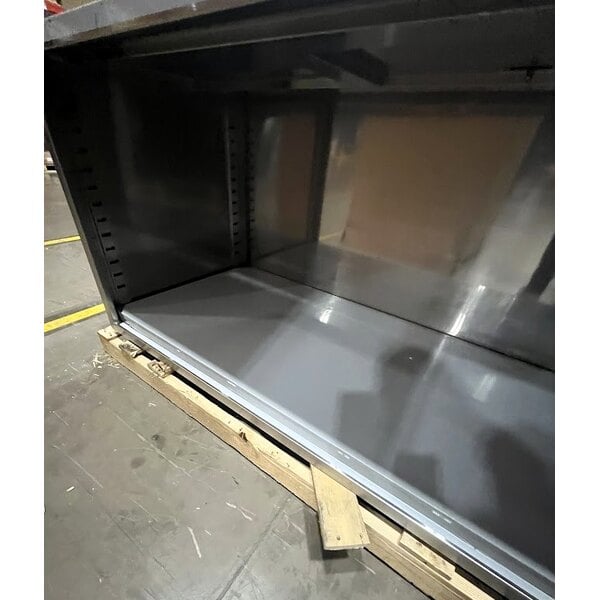 Scratch and Dent Regency 30" x 96" 16 Gauge Type 304 Stainless Steel Enclosed Base Table with Open Front and Adjustable Midshelf