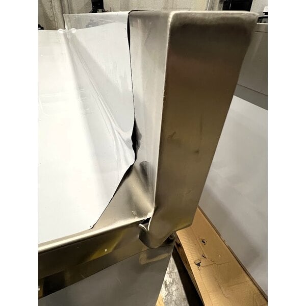 Scratch and Dent Regency 24" x 96" 16 Gauge Type 304 Stainless Steel Enclosed Base Sliding Door Table with Adjustable Midshelf and 6" Backsplash