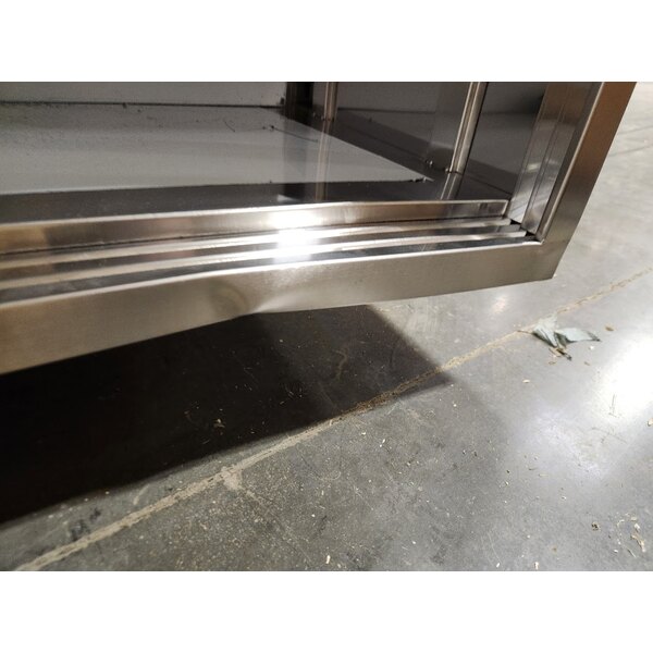 Scratch and Dent Regency C-2472-316 24" x 72" 16 Gauge Type 304 Stainless Steel Enclosed Base Table with Sliding Doors and Adjustable Midshelf