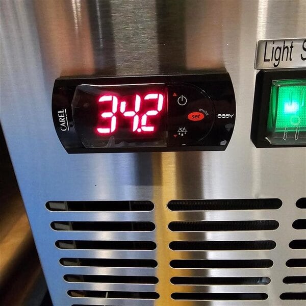 Scratch and Dent Avantco UBB-60-HC-S 60" Stainless Steel Counter Height Narrow Solid Door Back Bar Refrigerator with LED Lighting