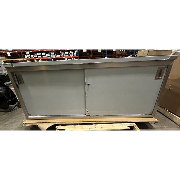 Scratch and Dent Regency C-2472-316 24" x 72" 16 Gauge Type 304 Stainless Steel Enclosed Base Table with Sliding Doors and Adjustable Midshelf