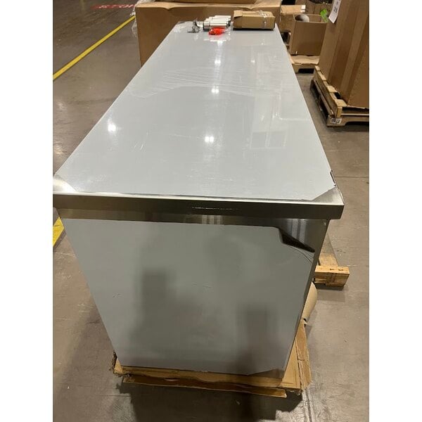 Scratch and Dent Regency C-2472-316 24" x 72" 16 Gauge Type 304 Stainless Steel Enclosed Base Table with Sliding Doors and Adjustable Midshelf