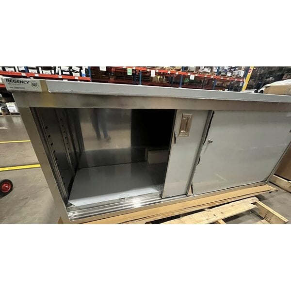 Scratch and Dent Regency C-2472-316 24" x 72" 16 Gauge Type 304 Stainless Steel Enclosed Base Table with Sliding Doors and Adjustable Midshelf