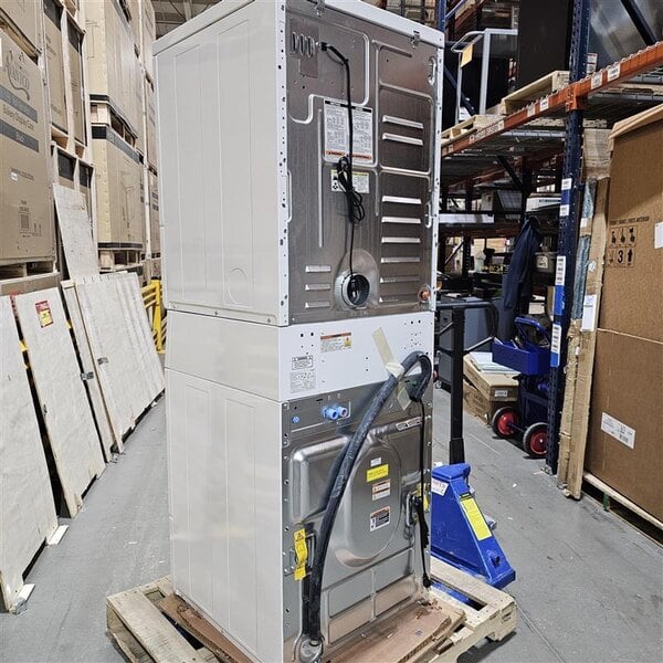 Scratch and Dent Speed Queen Quantum Gold Pro SV6000WG Stacked 3.42 cu. ft. 27" Front Load Electric Washer and 7.0 cu. ft. 27" Front Load Gas Powered Dryer - Coin Operated