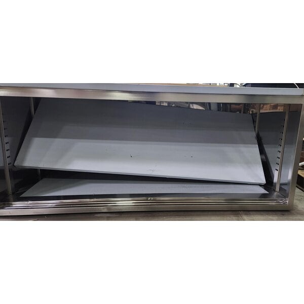 Scratch and Dent Regency C-3072-316 30" x 72" 16 Gauge Type 304 Stainless Steel Enclosed Base Table with Sliding Doors and Adjustable Midshelf