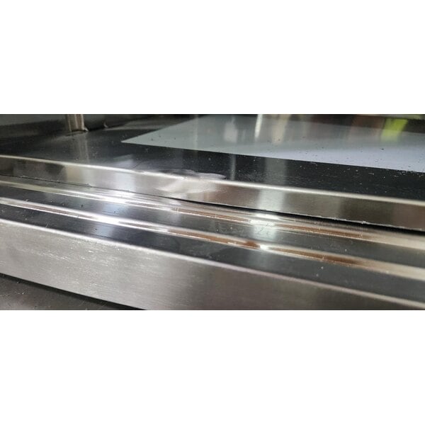 Scratch and Dent Regency C-3072-316 30" x 72" 16 Gauge Type 304 Stainless Steel Enclosed Base Table with Sliding Doors and Adjustable Midshelf