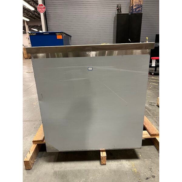 Scratch and Dent Regency 24" x 96" 16 Gauge Type 304 Stainless Steel Enclosed Base Table with Sliding Doors and Adjustable Midshelf