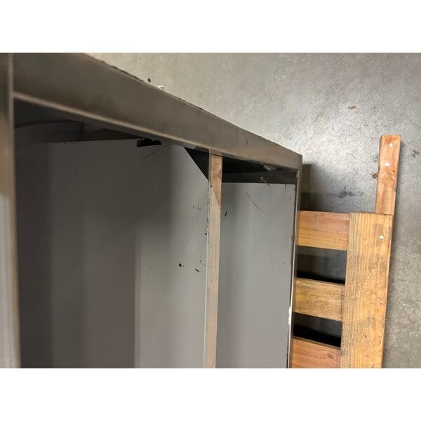 Scratch and Dent Regency 24" x 96" 16 Gauge Type 304 Stainless Steel Enclosed Base Table with Sliding Doors and Adjustable Midshelf