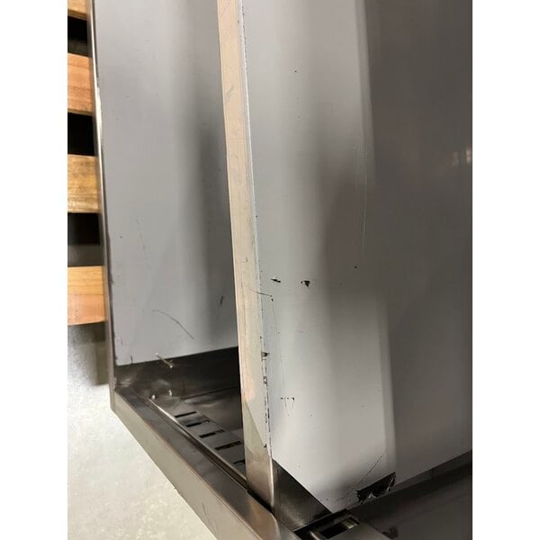 Scratch and Dent Regency 24" x 96" 16 Gauge Type 304 Stainless Steel Enclosed Base Table with Sliding Doors and Adjustable Midshelf