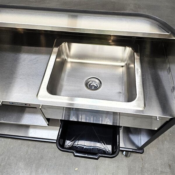 Scratch and Dent Lakeside 887B 63 1/2" Stainless Steel Portable Bar with Black Laminate Finish, 2 Removable 7-Bottle Speed Rails, and 40 lb. Ice Bin