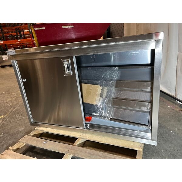 Scratch and Dent Regency 24" x 48" 16 Gauge Type 304 Stainless Steel Enclosed Base Table with Sliding Doors and Adjustable Midshelf