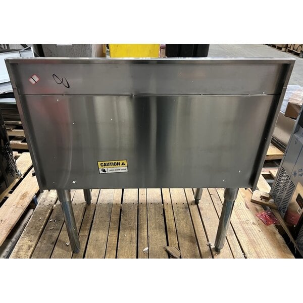 Scratch and Dent Regency 18" x 30" Stainless Steel Underbar Ice Bin with Bottle Holders - 98 lb.