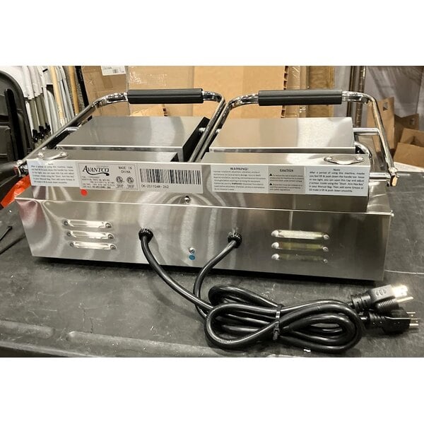 Scratch and Dent Avantco PG400GST Commercial Dual Panini Sandwich Grill with Timer, Grooved Top and Smooth Bottom Plates, and 19 5/8" x 9 1/8" Cooking Surface - 120V, 3500W
