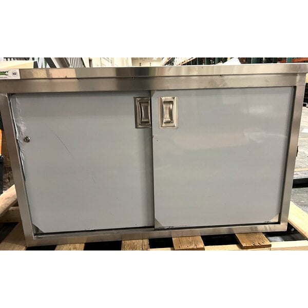 Scratch and Dent Regency 30" x 48" 16 Gauge Type 304 Stainless Steel Enclosed Base Table with Sliding Doors and Adjustable Midshelf