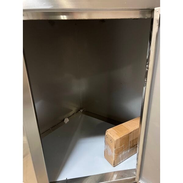 Scratch and Dent Regency Spec Line 24" x 24" 14-Gauge Stainless Steel Corner Work Table with Hinged Door and Lock