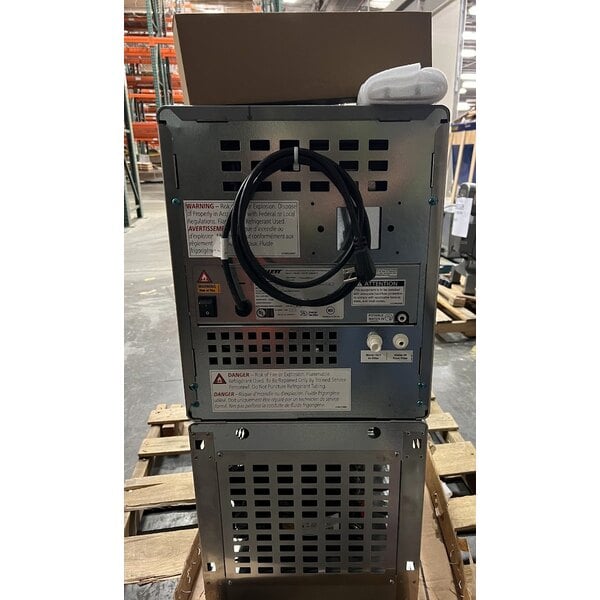 Scratch and Dent Follett 7UC114A-HW-CL-ST-00 Champion 7 Series Air-Cooled Chewblet Undercounter Ice Maker and Hot / Ambient Water Dispenser with 7 lb. Bin and Filter - 115V, 100 lb.